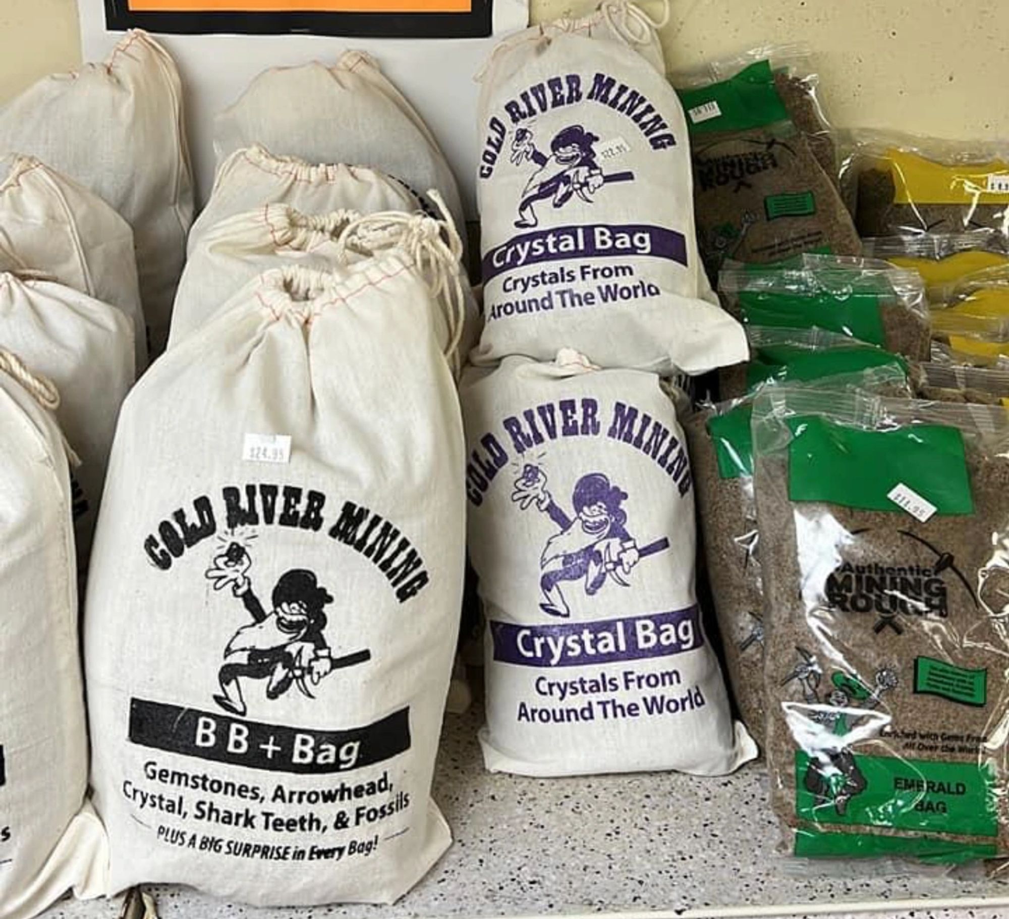 Cloth gem mining bags lined up on the shop shelf