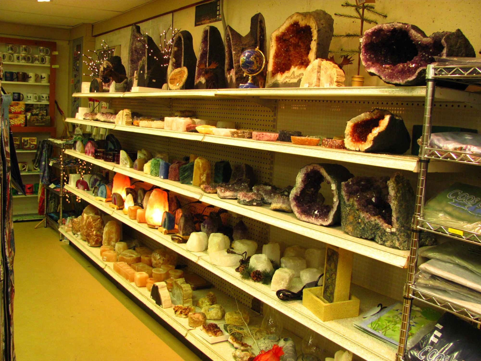 Shelves of geodes, crystals and polished stones inside the gift shop